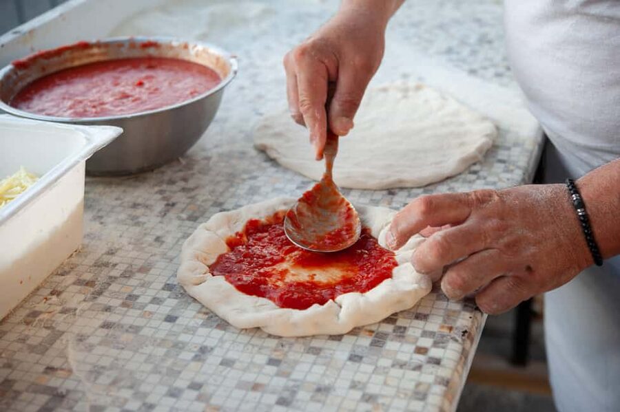 Amalfi Coast: Pizza & Mozzarella Class with Farmhouse visit - Baking pizza in the wood-fired oven
