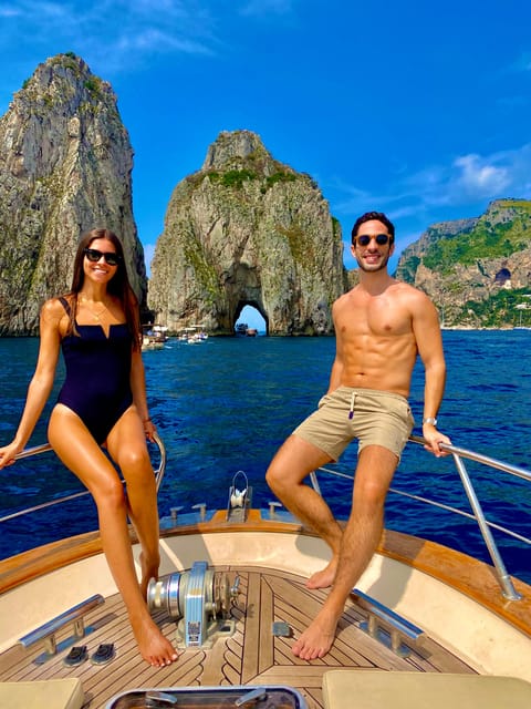 Capri: 2-hour boat tour of the caves and stacks - Passing beneath the faraglioni arch