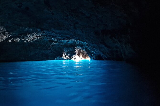 Capri & Anacapri Day Tour with Blue Grotto included from Sorrento - Entering the Blue Grotto by paddle boat