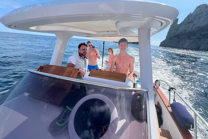 Capri and Blue Grotto Small Group Boat Tour - The Saints Grotto and Green Grotto swimming stop