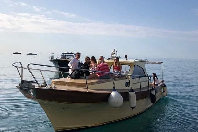 Capri Collective Boat Excursion from Positano - Swimming in clear water, with one caution