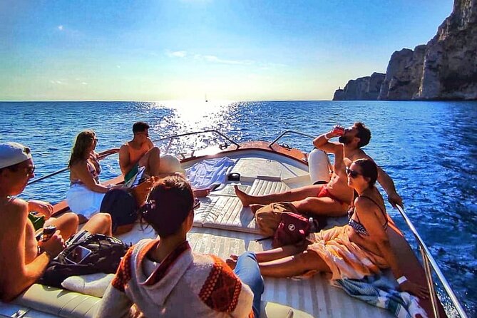 Capri Guided Boat Experience with Island Exploration and Transfer - The Faraglioni Rocks from the water