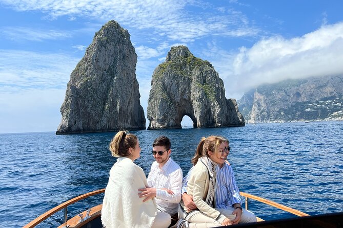 Capri in a Day All Inclusive Premium Boat Tour + City Visit - The northern coast: beaches, Roman bathing places, and the Blue Grotto