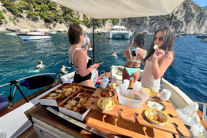 Capri Premium Boat Tour and City Visit Free Bar and Aperitif - Sailors, Faraglioni, and the White and Red Caves
