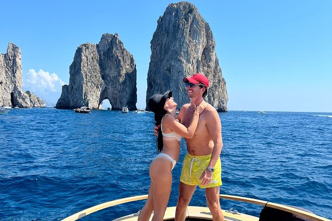 Capri Premium Boat Tour and City Visit Free Bar and Aperitif - The first coastal stops: Bagni di Tiberio and the Blue Grotto
