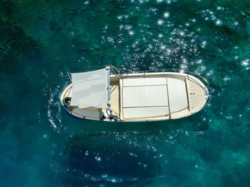Capri: private boat tour with visit to the caves - The Green Grotto and Punta Carena Lighthouse
