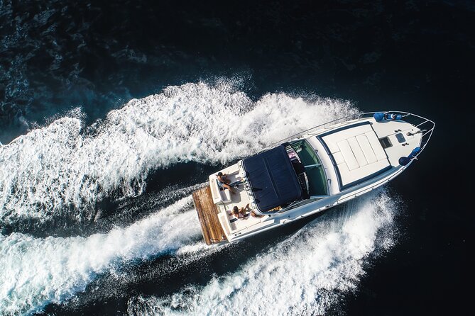 Exclusive Private Capri Boat Tour from Sorrento – Swim & Explore - Passing beneath the Faraglioni
