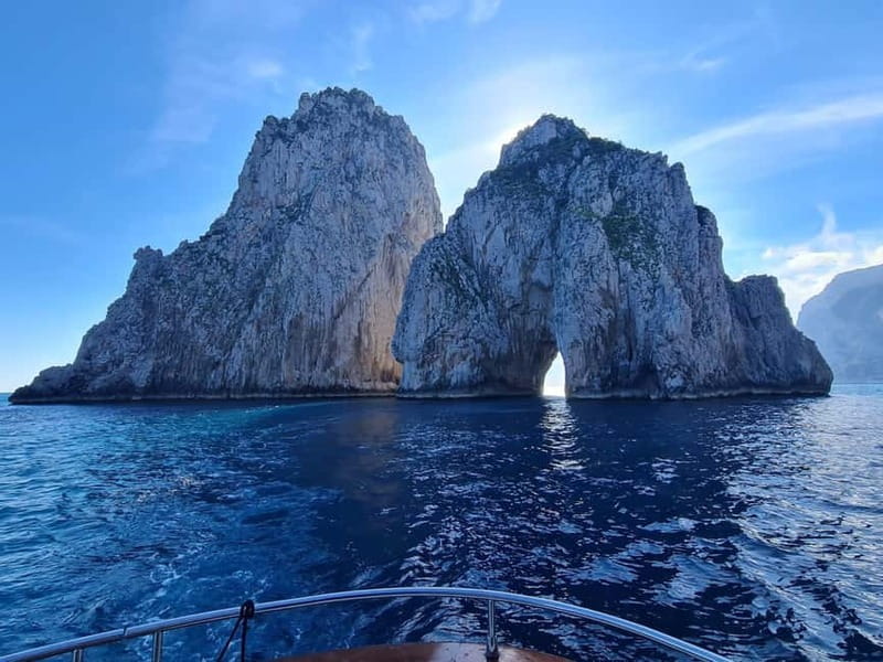 From Sorrento: Capri Boat Tour with Blue Grotto Visit - Passing beneath the Faraglioni