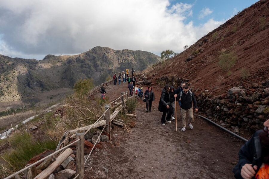 From Sorrento: Pompeii and Vesuvius Guided Tour with Lunch - Entering Pompeii with a guide