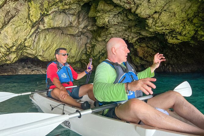 Kayak tour in Capri between caves and beaches. Photos included. - Paddling into Grotta dell’Acqua