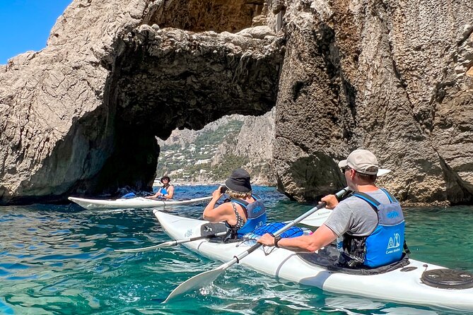 Kayak tour in Capri between caves and beaches. Photos included. - Passing beneath Arco della Stella