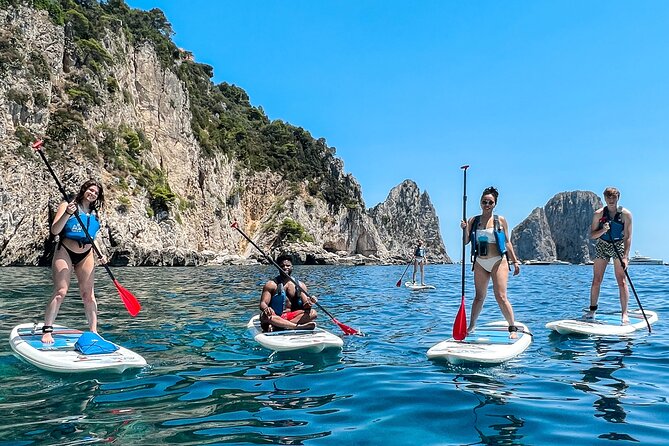 Paddleboard in Capri between caves and beaches. Photos included! - The Faraglioni photo stop