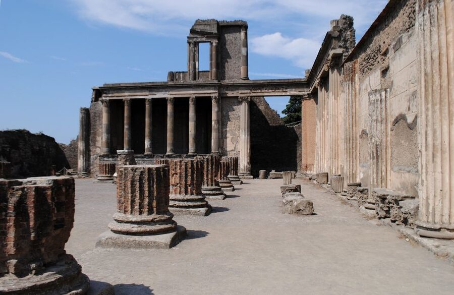 Pompeii Half-Day Coach Tour from Sorrento - Entering Pompeii with a guide