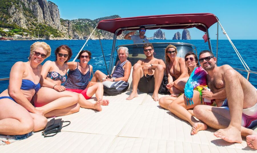 Positano: Small-Group Boat Excursion to Capri Island - Capri’s cliffs, villas, and famous rock formations