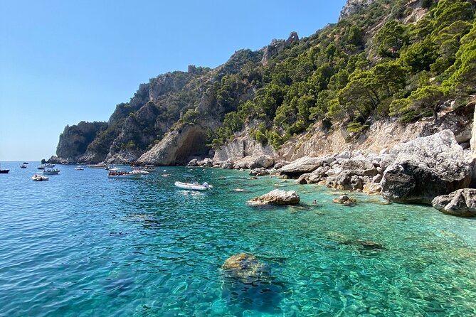 Private boat trip to Capri - Passing beneath the Faraglioni arch