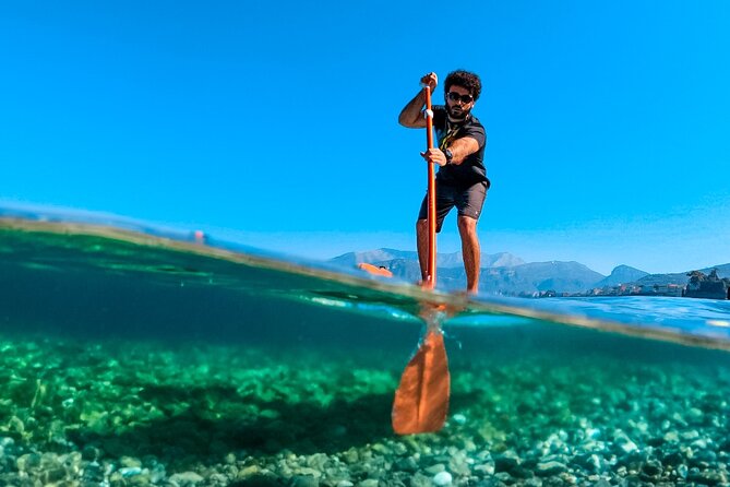 Small group paddle boarding tour to Bagni Regina Giovanna - Entering Bagni Regina Giovanna through the cliff