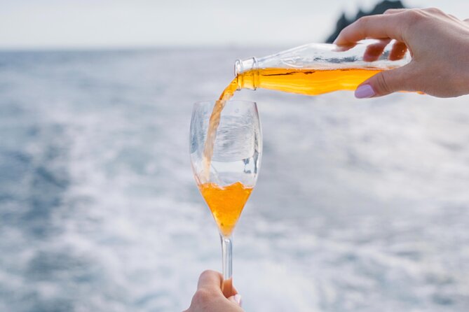 Small Group Tour in Positano by Boat at Sunset with Prosecco - Comfort, Clothing, and Sea Conditions