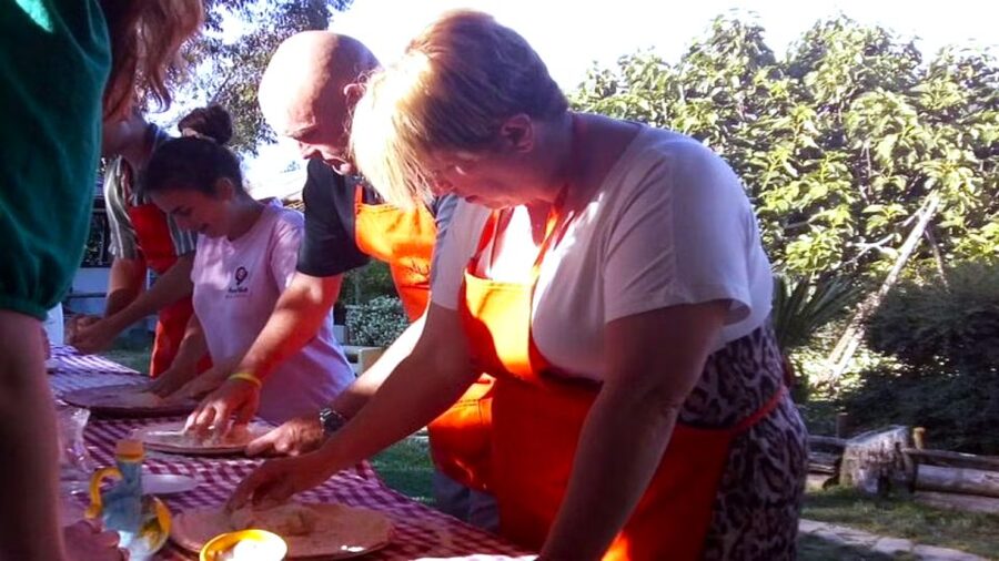 Sorrento: Half-Day Pizza Making, Wine, Limoncello & Pick-Up - Stretching dough and choosing a classic topping
