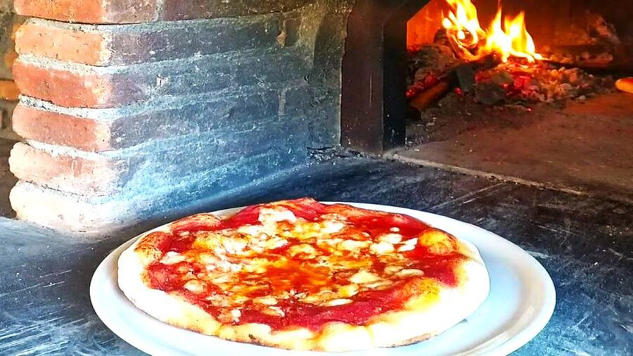 Sorrento: Half-Day Pizza Making, Wine, Limoncello & Pick-Up - The wood-fired oven does the final work
