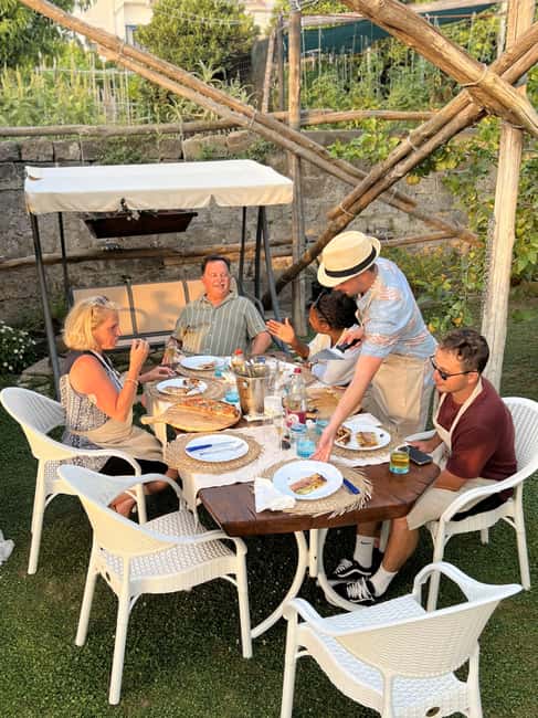 Sorrento: Pizza Class with Sea View - Eating your pizza as the sun goes down