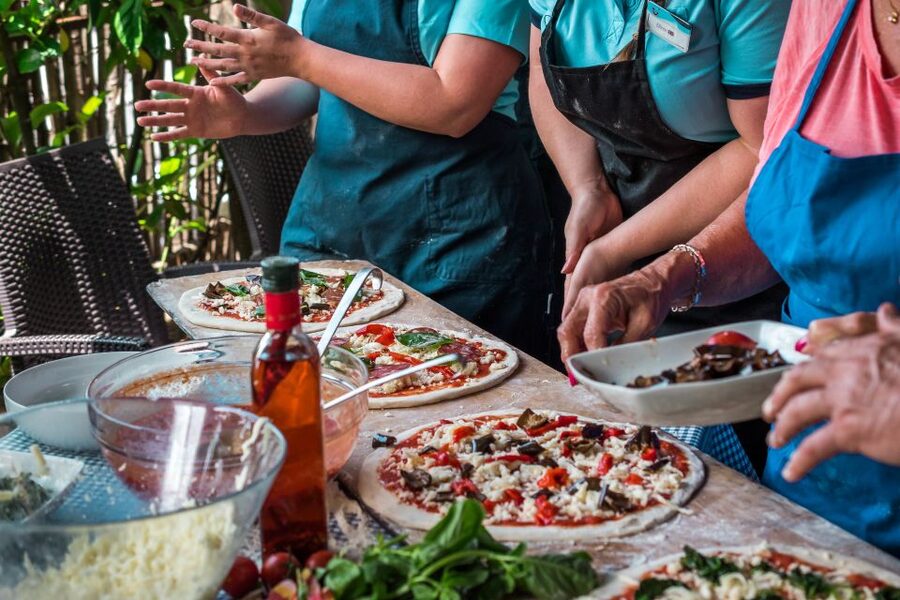 Sorrento: Pizza Making Class at Tirabusciò Cooking School - Choosing toppings and baking your own pizza
