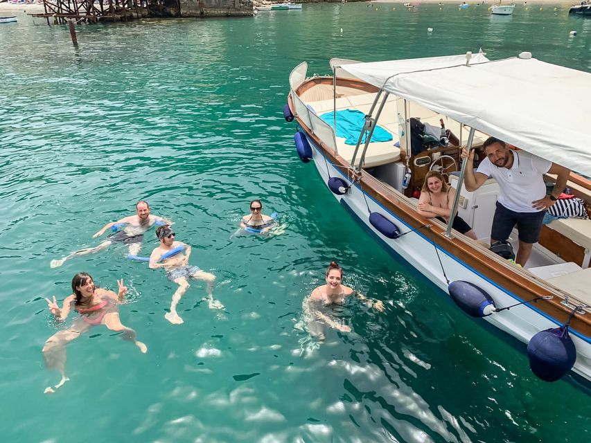 Sorrento: Sightseeing Cruise with Limoncello Tasting - Puolo Bay, fishing boats, and Vesuvius