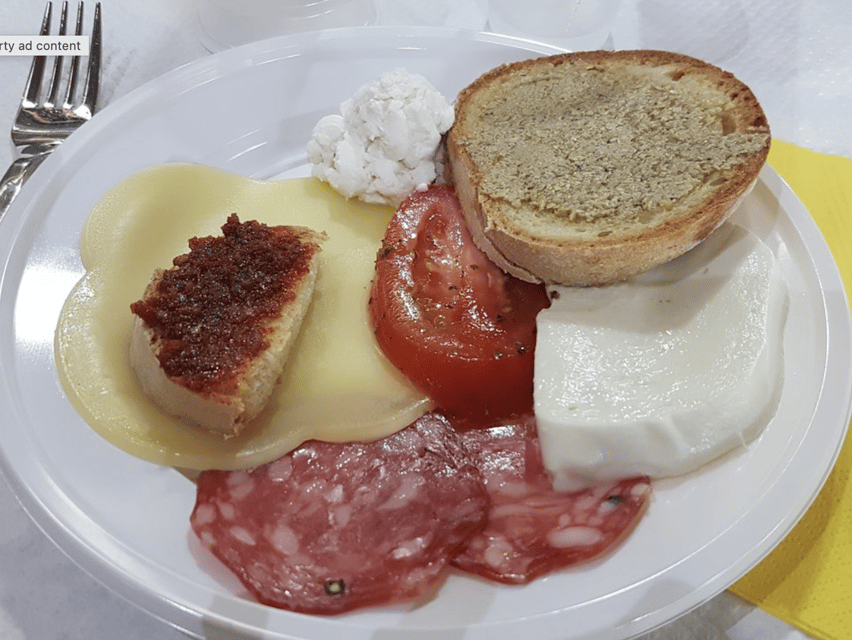 Sorrento: Walking Tour in Lemon Garden w/ Food Tasting - A Farm Table Spread With Wine