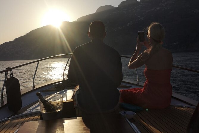 Sunset Group Boat Tour from Positano or Praiano - Boarding a traditional wooden gozzo